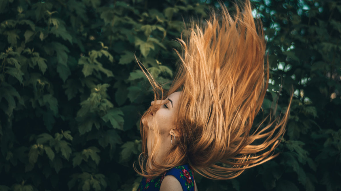 root-cause-of-hair-loss-girl-flipping-her-hair