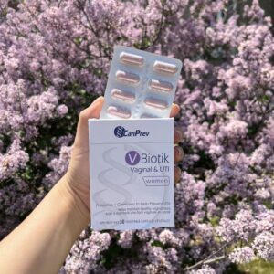 CPW V-Biotik against an outdoor backdrop of lilac flowers